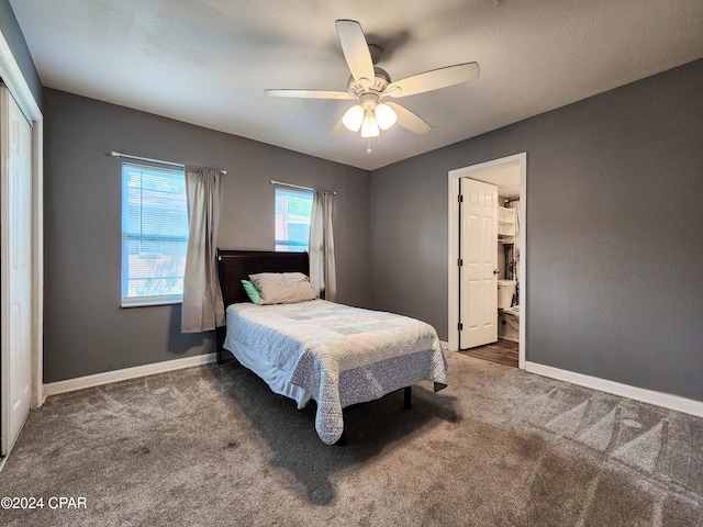 carpeted bedroom with a closet and ceiling fan