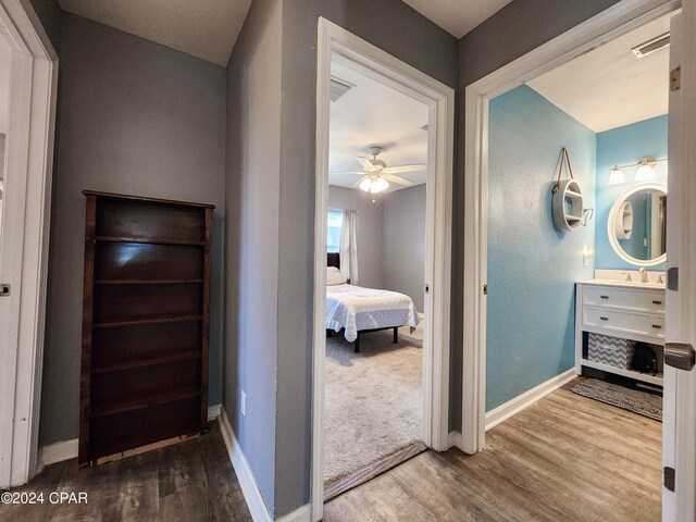 bedroom featuring ceiling fan and wood-type flooring