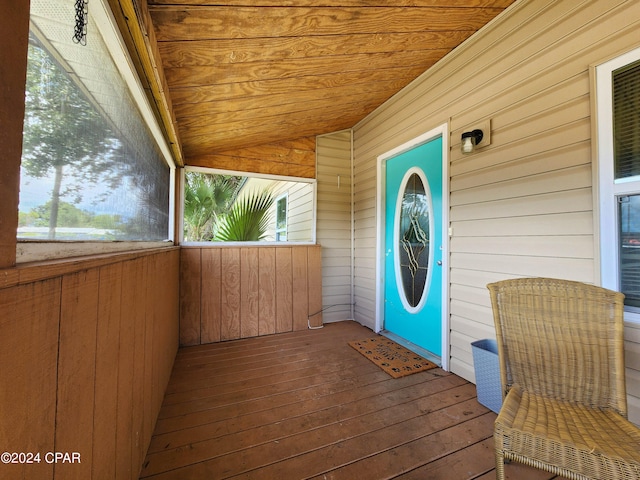 property entrance featuring a wooden deck