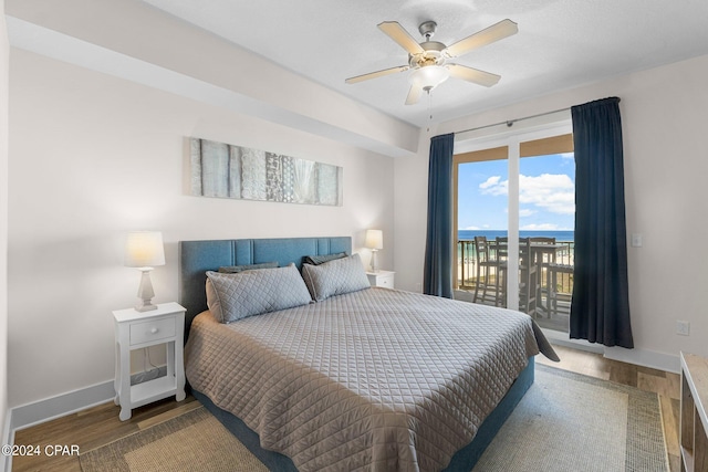 bedroom featuring wood-type flooring, ceiling fan, and access to exterior