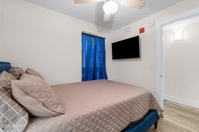 bedroom featuring ceiling fan and hardwood / wood-style floors