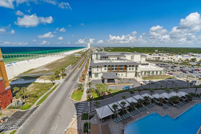 aerial view with a water view and a view of the beach