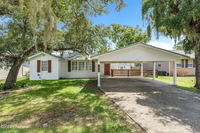 single story home with a carport and a front lawn