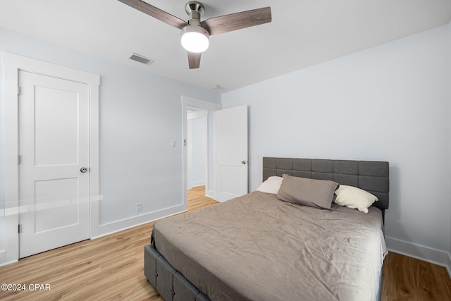 bedroom with hardwood / wood-style flooring and ceiling fan