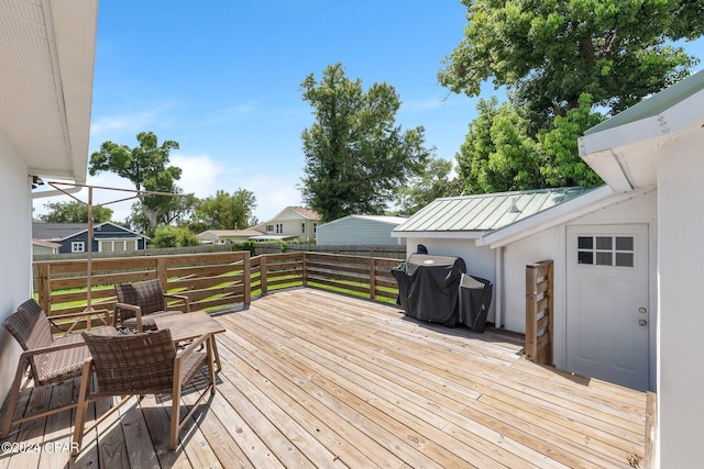 wooden terrace with area for grilling