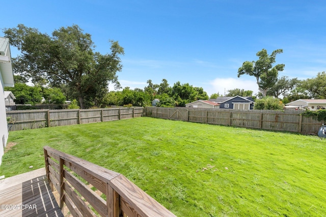 view of yard with a wooden deck