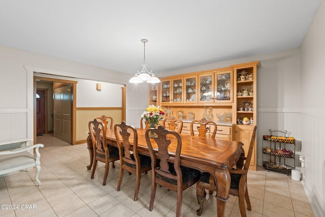 dining space featuring light tile patterned floors