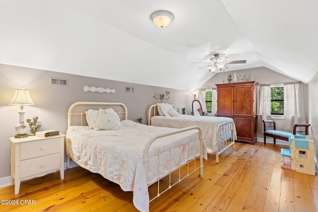 bedroom featuring vaulted ceiling, ceiling fan, and light hardwood / wood-style flooring