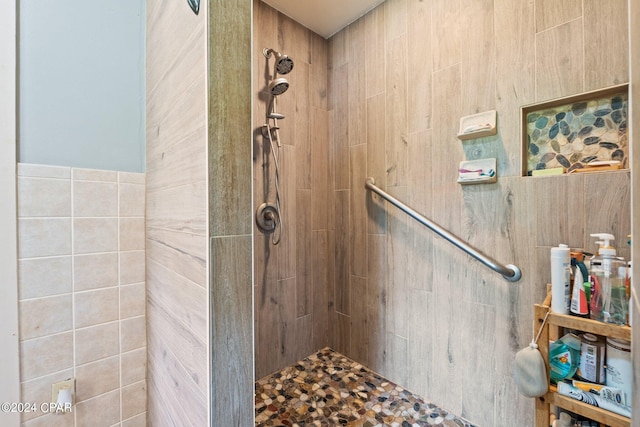 bathroom with a tile shower