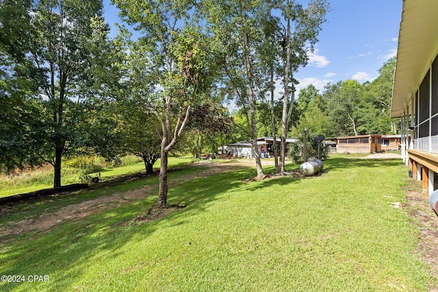 view of yard featuring a sunroom