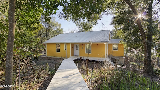 view of front of property featuring metal roof