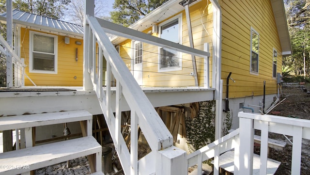 view of side of home with metal roof