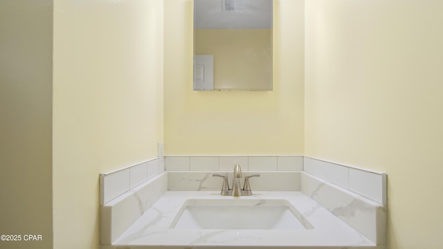 bathroom with visible vents and vanity