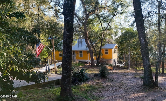 view of front of house featuring metal roof