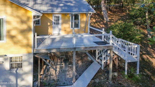 wooden terrace featuring stairway