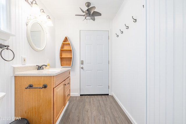 bathroom featuring ceiling fan, vanity, and hardwood / wood-style floors