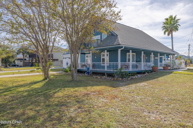 view of front of home featuring a front lawn and covered porch