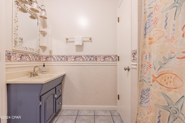 bathroom with tile patterned flooring and vanity