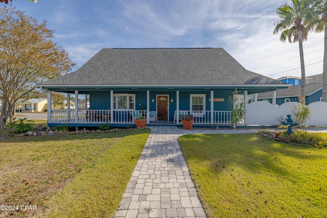 farmhouse with a front yard and a porch