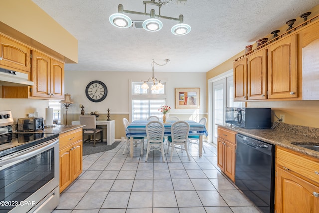 kitchen featuring an inviting chandelier, black appliances, pendant lighting, and light tile patterned floors