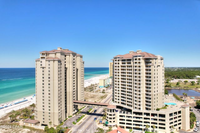 bird's eye view featuring a beach view and a water view