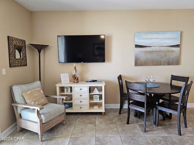 dining room featuring light tile patterned flooring