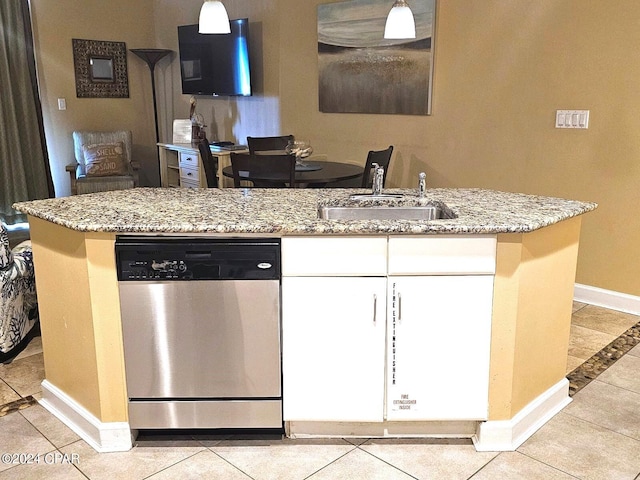 kitchen with white cabinets, dishwasher, light tile patterned floors, and sink