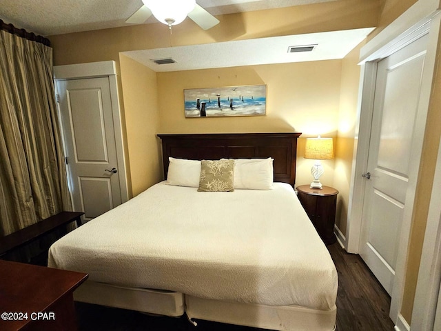 bedroom featuring dark hardwood / wood-style floors and ceiling fan