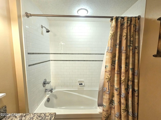 bathroom featuring shower / tub combo with curtain