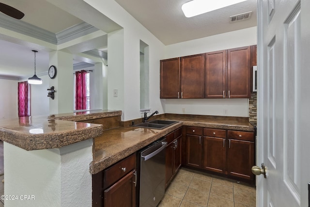 kitchen featuring sink, light tile patterned floors, decorative light fixtures, stainless steel dishwasher, and kitchen peninsula