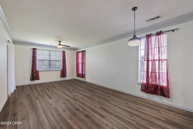 unfurnished room featuring dark hardwood / wood-style flooring, crown molding, plenty of natural light, and ceiling fan