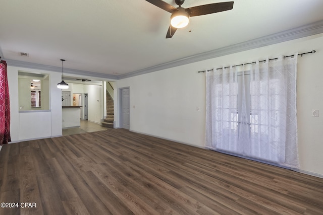 unfurnished living room with crown molding, dark hardwood / wood-style floors, and ceiling fan