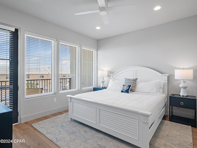 bedroom featuring ceiling fan and hardwood / wood-style floors