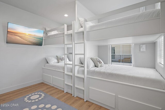 101 Deluna Pl Unit A, Panama City Beach, FL 32413 - bedroom with recessed lighting, wood finished floors, and baseboards