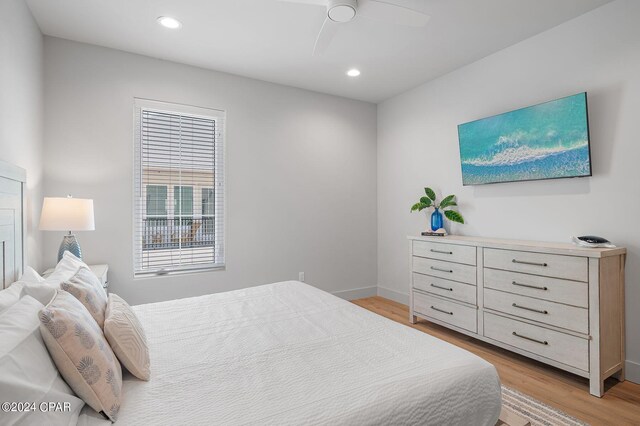101 Deluna Pl Unit A, Panama City Beach, FL 32413 - bedroom with recessed lighting, light wood-style floors, a ceiling fan, and baseboards