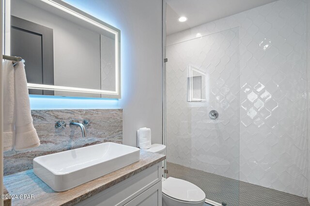 101 Deluna Pl Unit A, Panama City Beach, FL 32413 - full bathroom with recessed lighting, toilet, vanity, and tiled shower