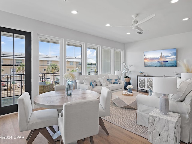 dining room with light hardwood / wood-style flooring and ceiling fan