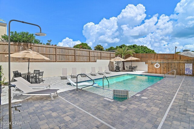 101 Deluna Pl Unit A, Panama City Beach, FL 32413 - pool with a patio and fence