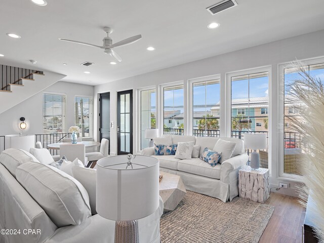 101 Deluna Pl Unit A, Panama City Beach, FL 32413 - living room with ceiling fan, stairs, visible vents, and recessed lighting