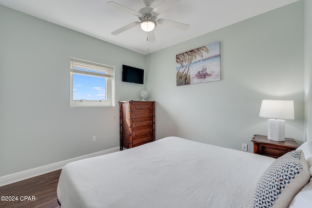 bedroom with ceiling fan and dark hardwood / wood-style flooring