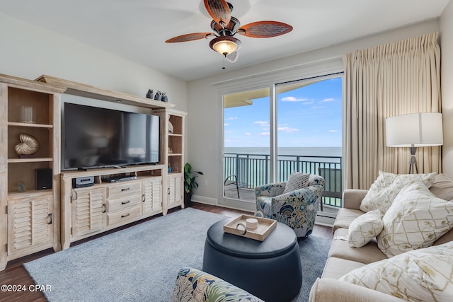 living room featuring dark hardwood / wood-style flooring and ceiling fan