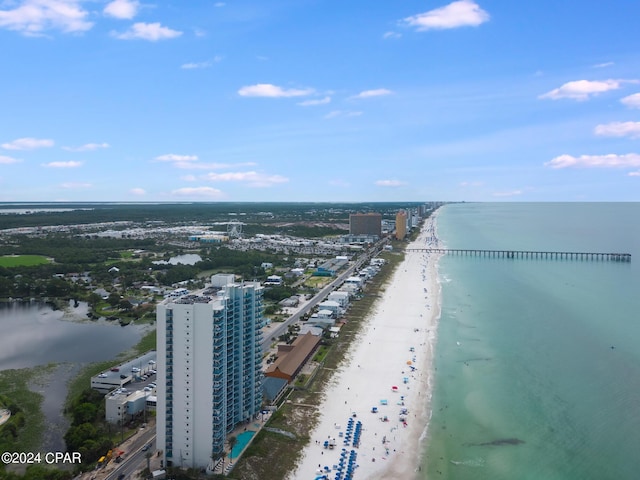 drone / aerial view featuring a view of the beach and a water view