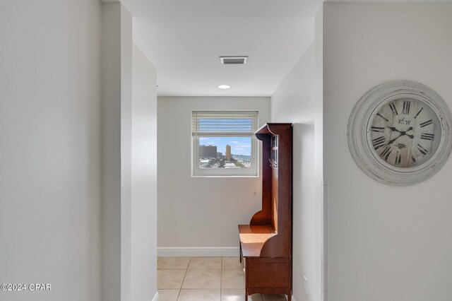 hallway featuring light tile patterned floors