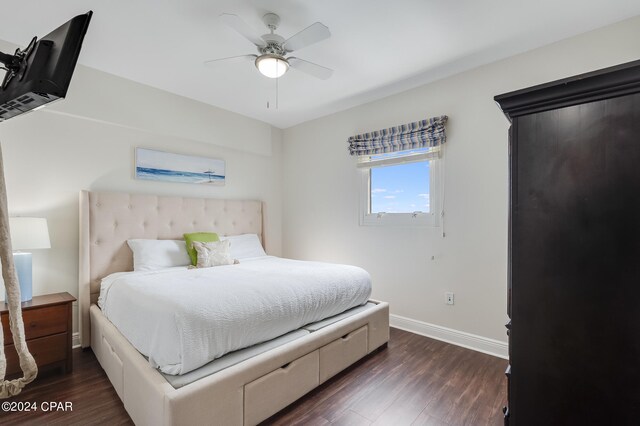 bedroom featuring ceiling fan and dark wood-type flooring