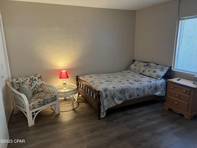 bedroom featuring wood finished floors