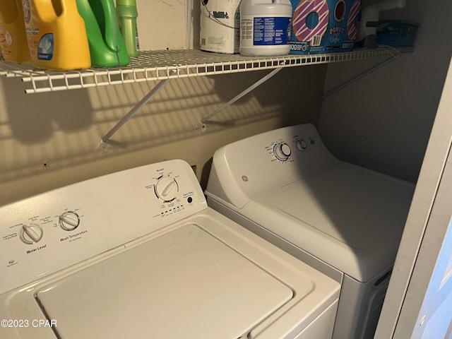 washroom with laundry area and separate washer and dryer