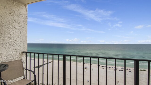 balcony with a view of the beach and a water view