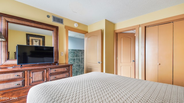 bedroom featuring a textured ceiling