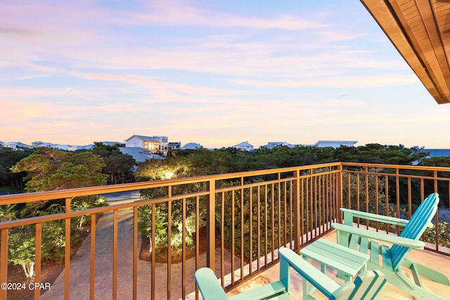 view of balcony at dusk