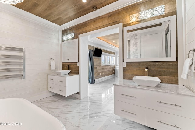 bathroom featuring wood walls, wooden ceiling, vanity, and a bathing tub